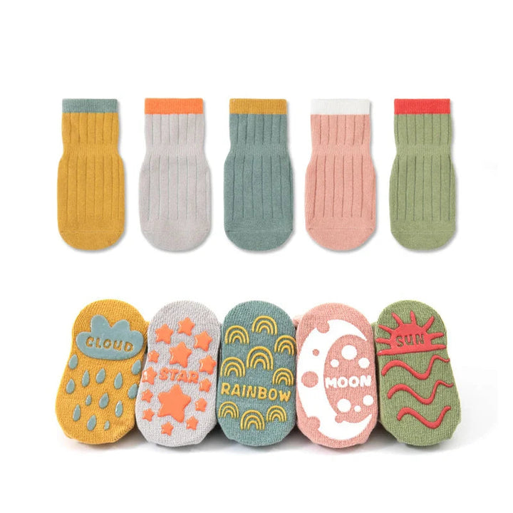 Five pairs of ribbed socks with colorful cuffs and cloud, star, rainbow, moon, and sun grip designs