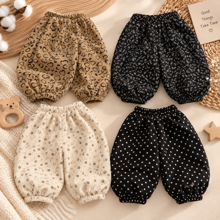 Four pairs of patterned corduroy-look pants with elastic waists and gathered ankle cuffs