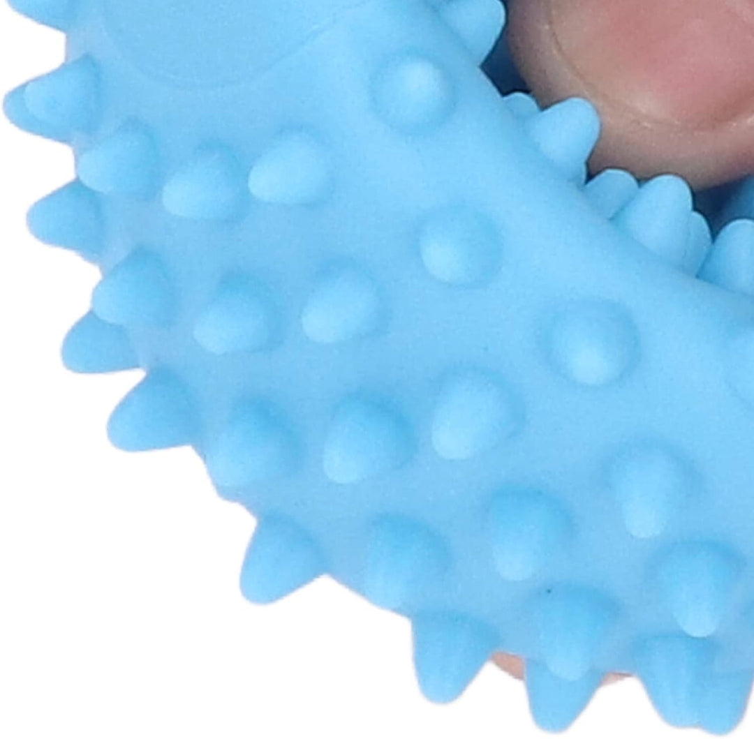 Close-up of a blue sensory ball being pressed to show its flexible, textured surface