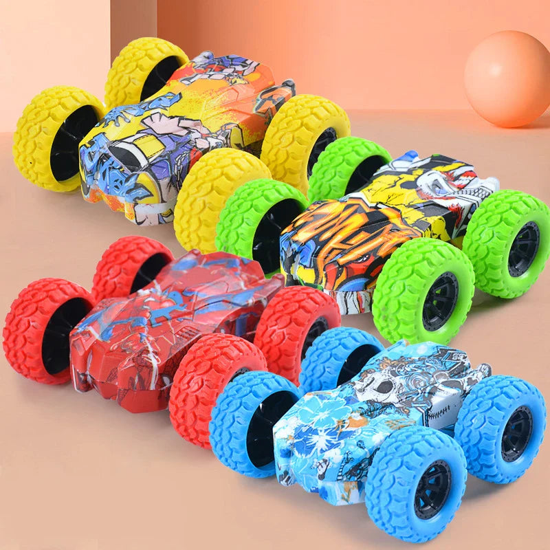 Four inertia toy cars with graphic bodies and yellow, green, red, and blue textured wheels.