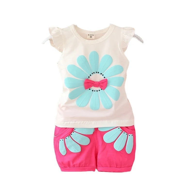 Cotton baby outfit with an aqua flower on the white top and bright pink floral shorts