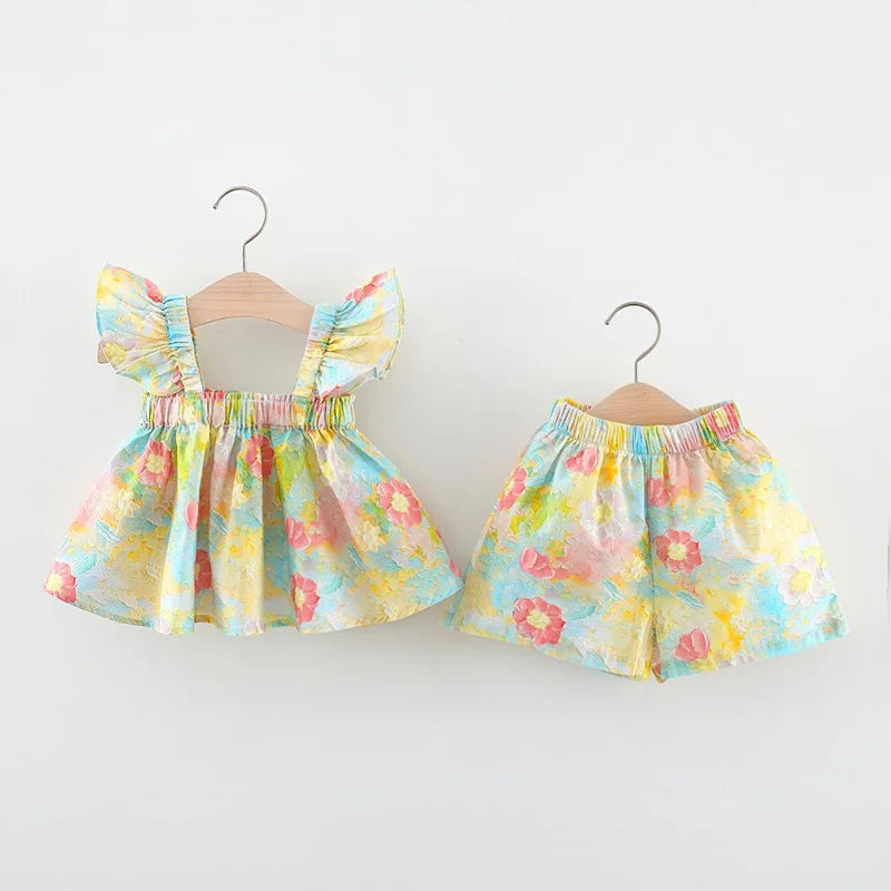 Floral baby top and matching pull-on shorts displayed side by side