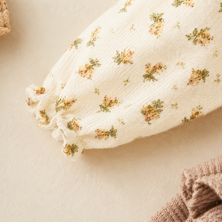 Close-up of the floral blouse sleeve and elastic ruffle cuff
