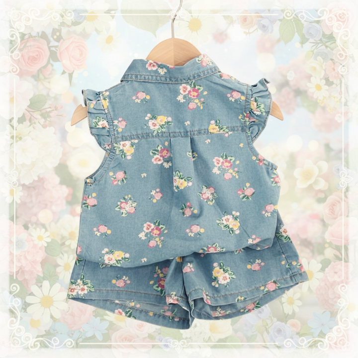 Back view of a blue floral top with ruffled shoulders and matching shorts