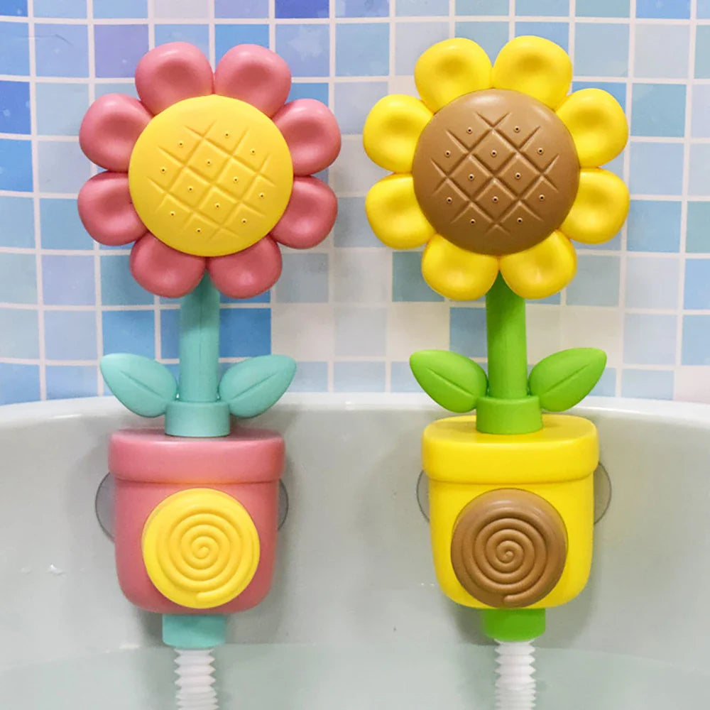 Red and yellow flower bath toys mounted side by side against a tiled bathtub wall