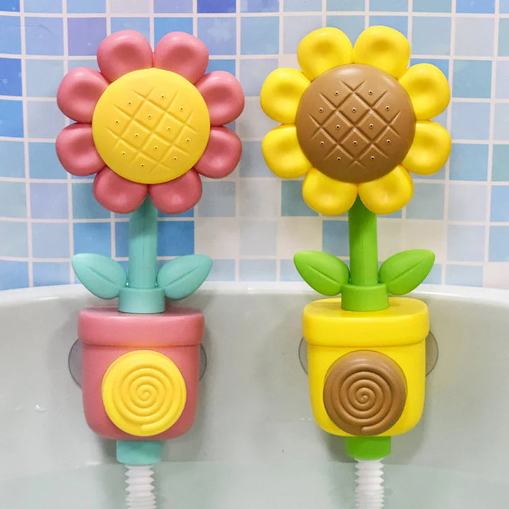 Red and yellow flower bath toys mounted side by side against a tiled bathtub wall