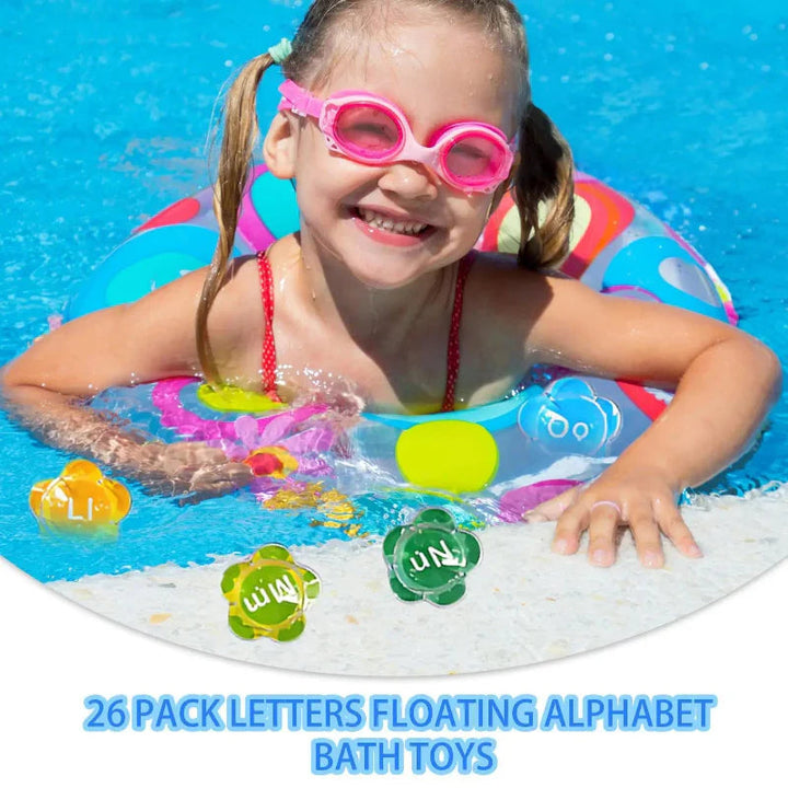 Child in pink goggles playing in a pool with floating flower-shaped alphabet pieces.