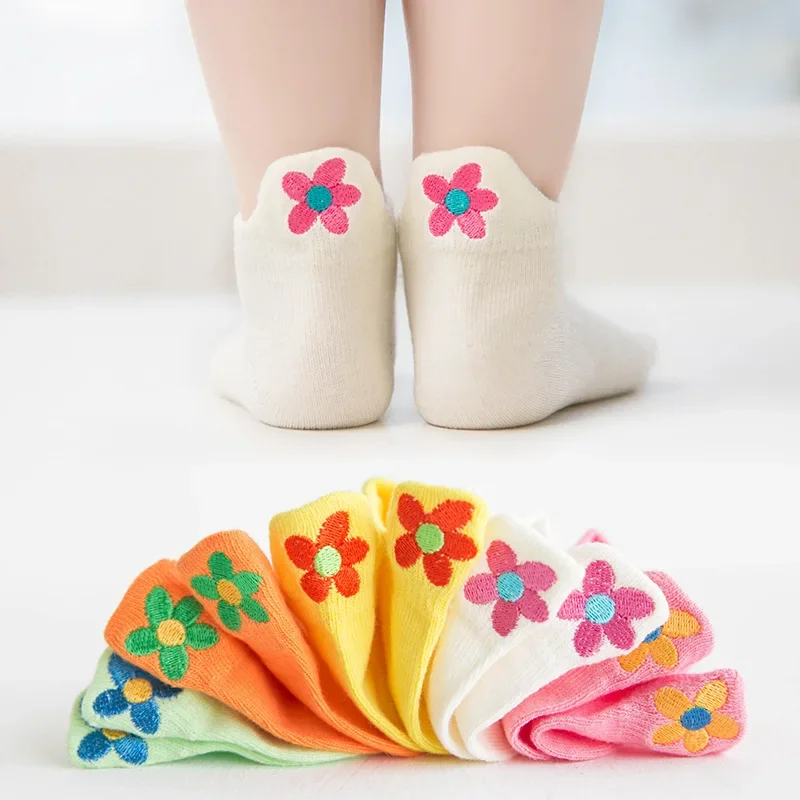 Flower sock set with five colorful pairs and white socks shown from the back