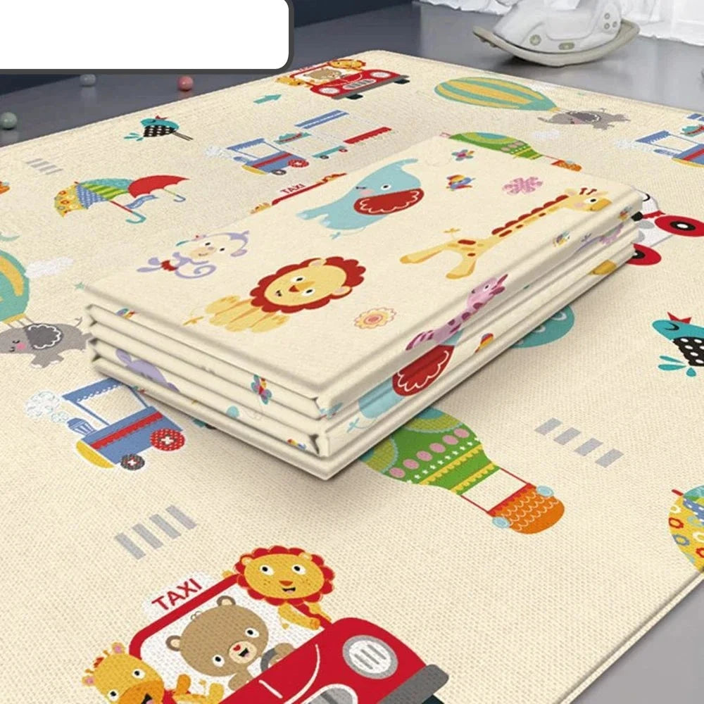Folded foam play mat on an open mat with animals, cars, and hot air balloon illustrations