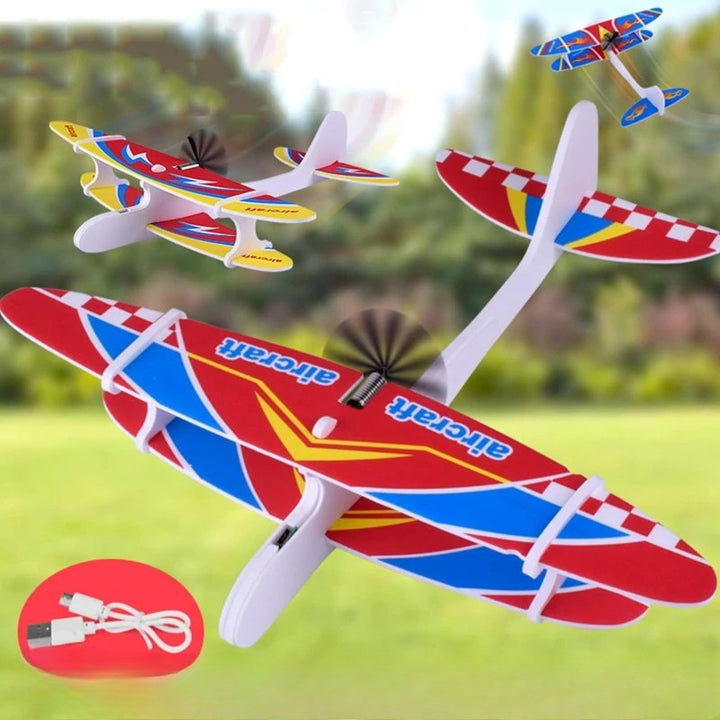 Colorful foam propeller airplanes shown outdoors with a USB charging cable inset
