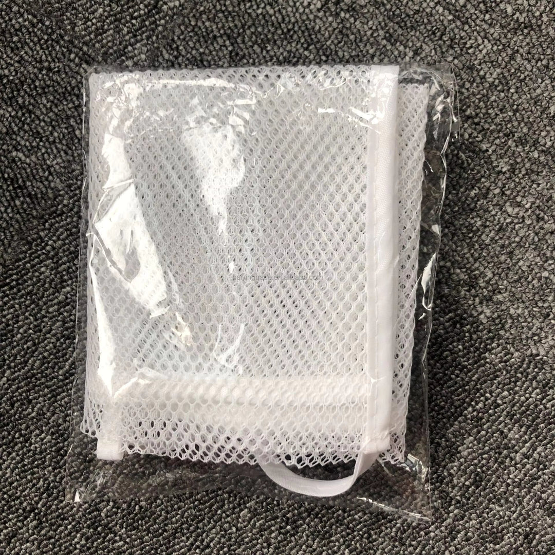 Folded white mesh bath organizer inside clear packaging