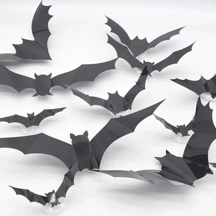 Close-up of black plastic bats with folded wings creating a raised 3D shape