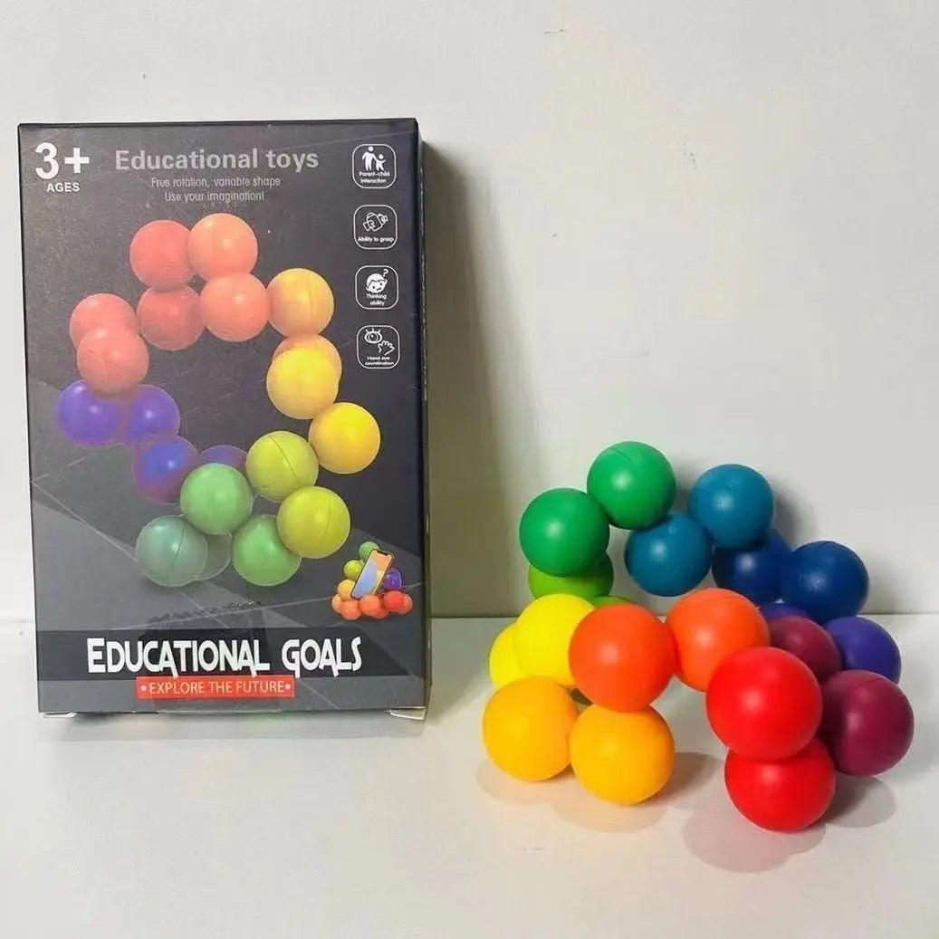 Rainbow ball puzzle folded into a compact shape beside its retail box