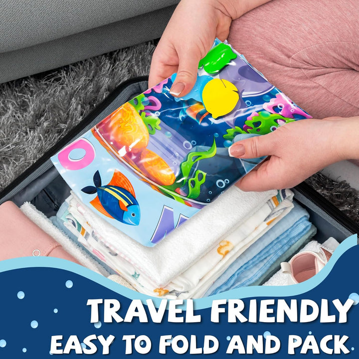 Folded baby water mat being packed into a suitcase