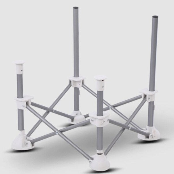 Bare cross-braced chair frame with white joints and wide feet