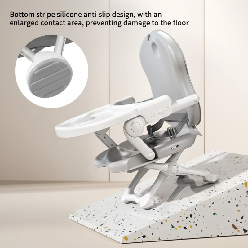Gray folding high chair with a close-up of the textured foot pad