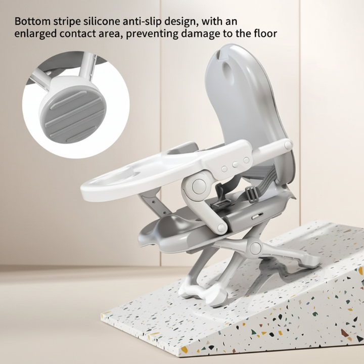 Gray folding high chair with a close-up of the textured foot pad