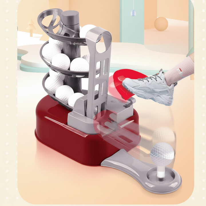 Foot pressing the red pedal on a mini golf ball feeder beside the extended tee