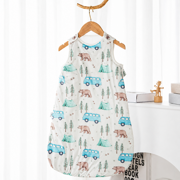 Baby sleep sack patterned with bears, pine trees, and blue vans