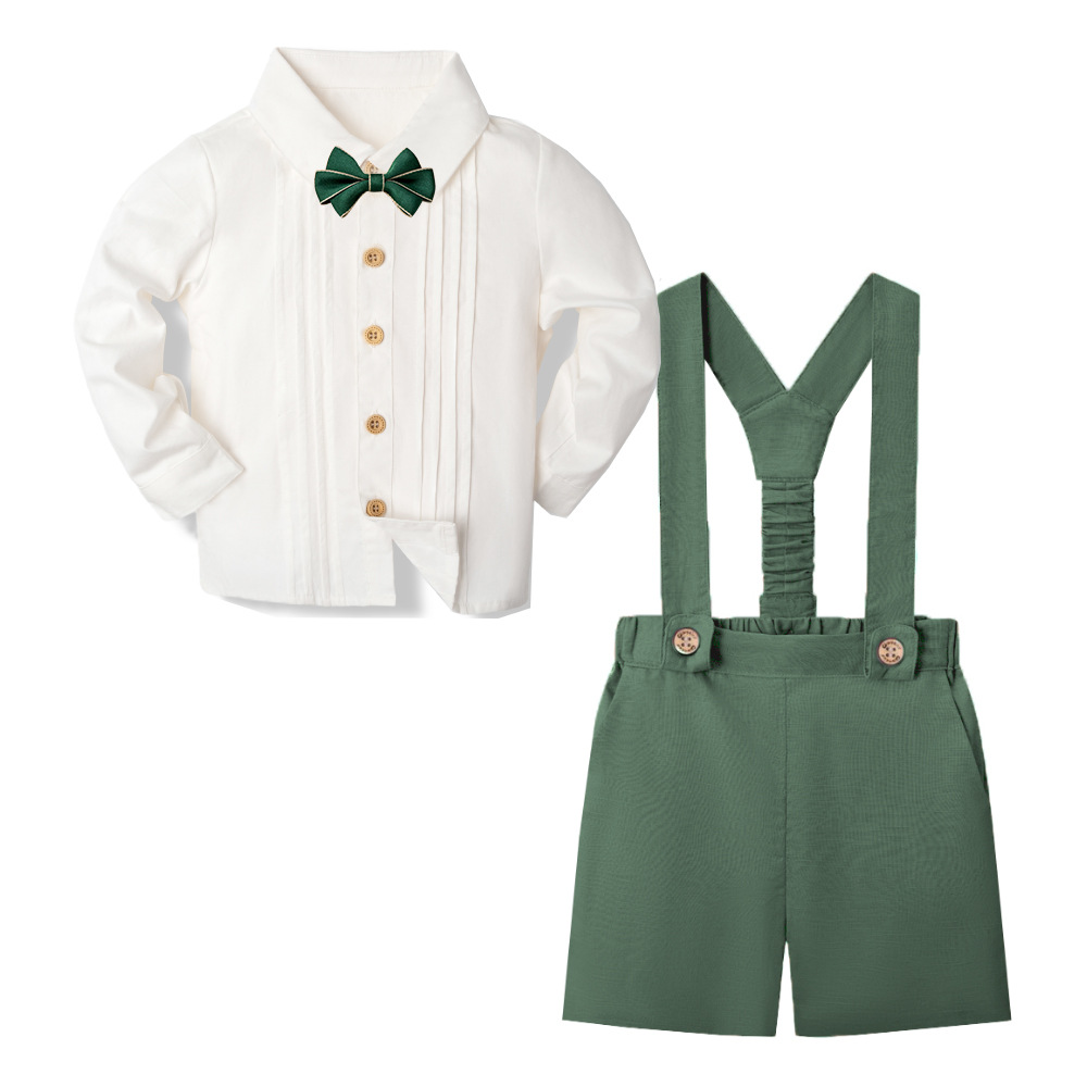 Forest green suspender shorts with a white long-sleeve shirt and green bow tie