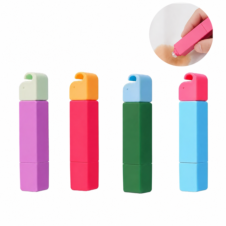 Four capped stain remover pens with an inset showing application to fabric
