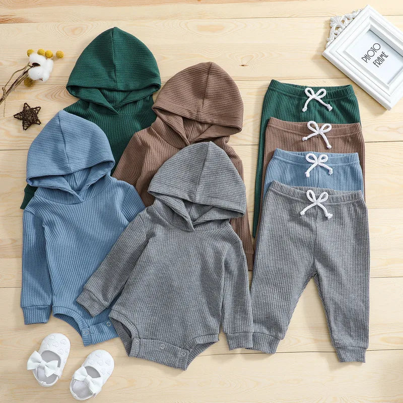 Hooded baby bodysuits and matching pants in dark green, brown, blue, and gray
