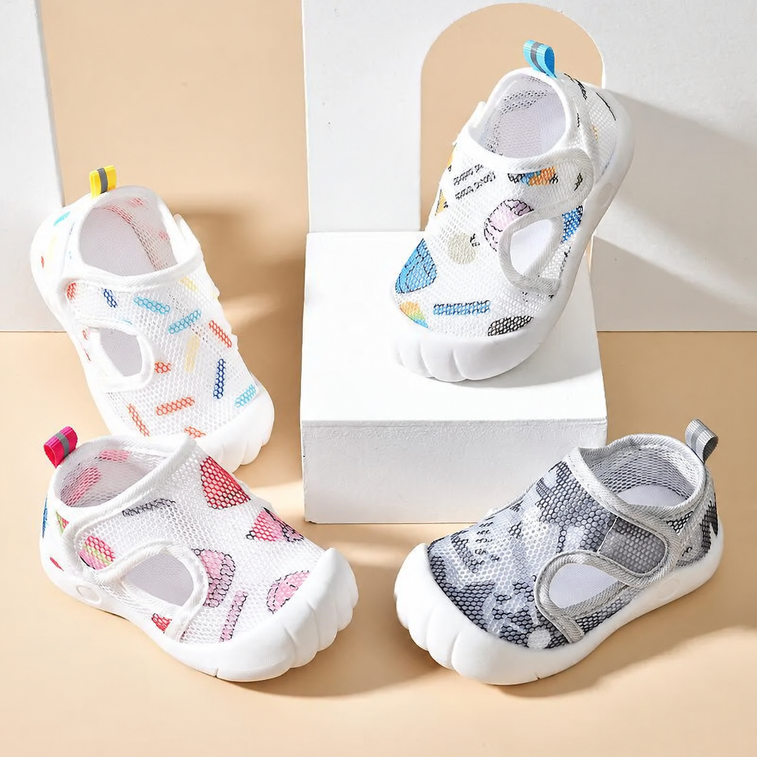 White, blue, pink and gray printed mesh sandals arranged on display blocks
