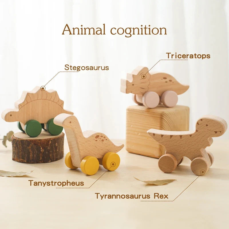 Wooden dinosaur cars labeled Stegosaurus, Triceratops, Tanystropheus, and Tyrannosaurus Rex