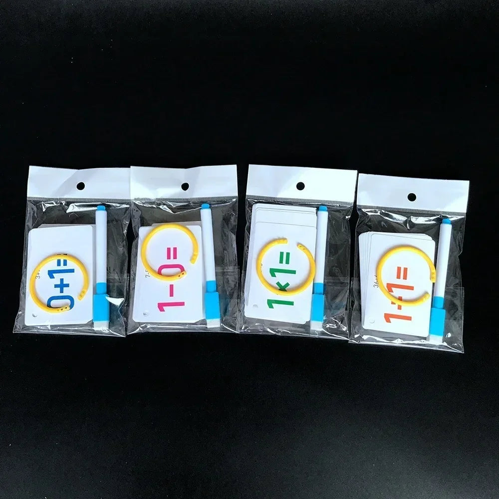 Four packaged arithmetic card sets with yellow rings and blue-and-white markers.