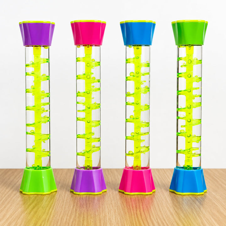 Four clear spiral sensory tubes with yellow tracks and colorful end caps