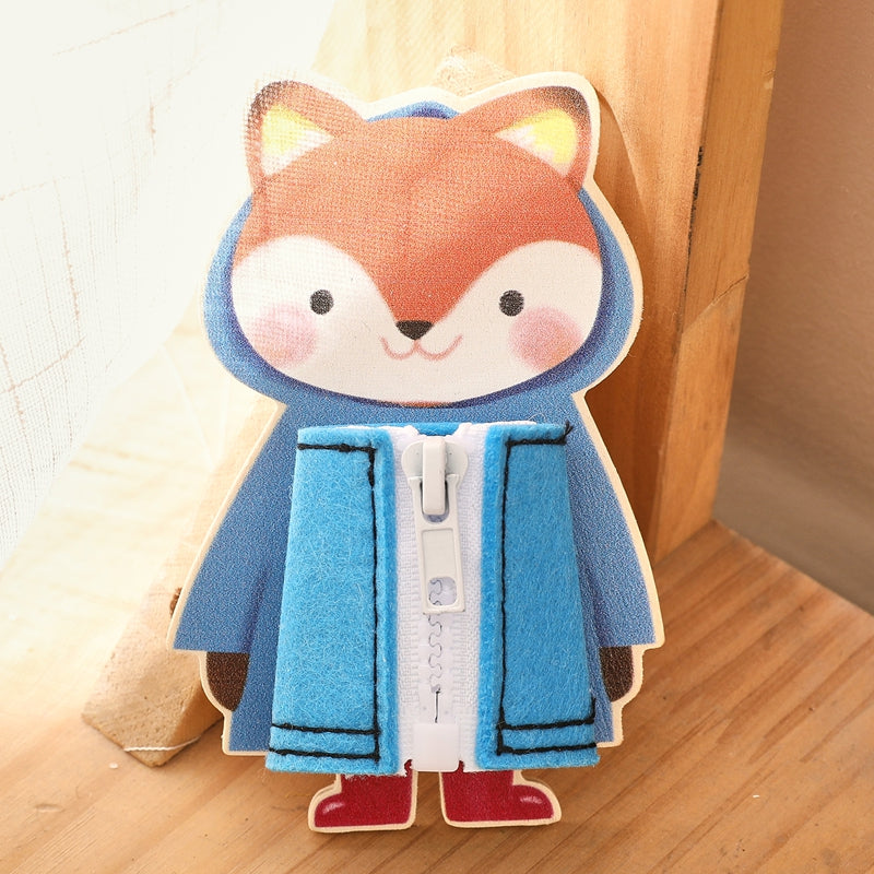 Fox dressing board with a blue fabric jacket and white zipper on a wooden ledge