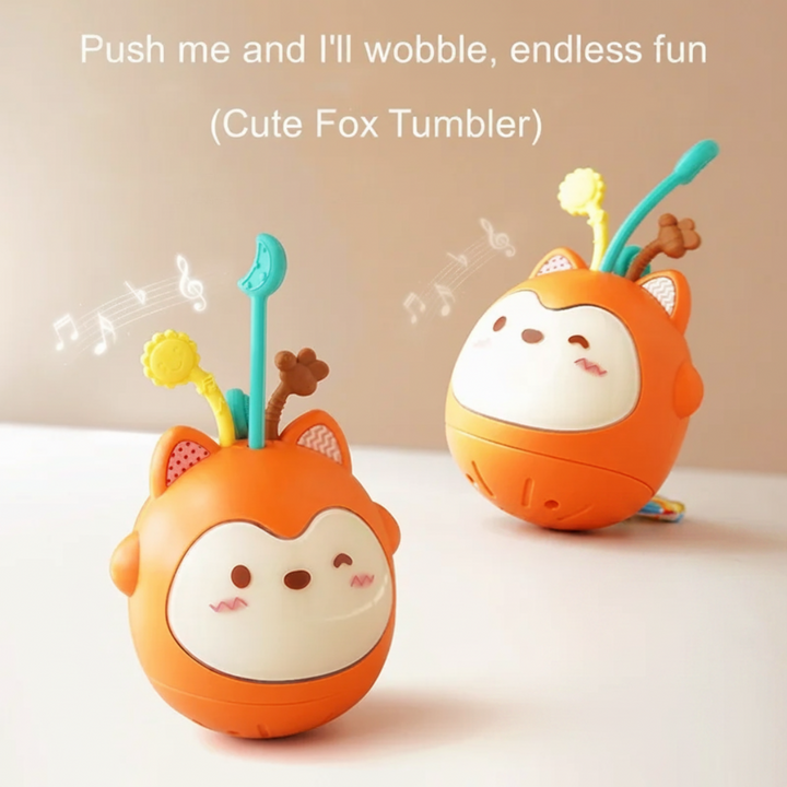 Orange fox musical toy shown upright and tilted to demonstrate its wobble motion.