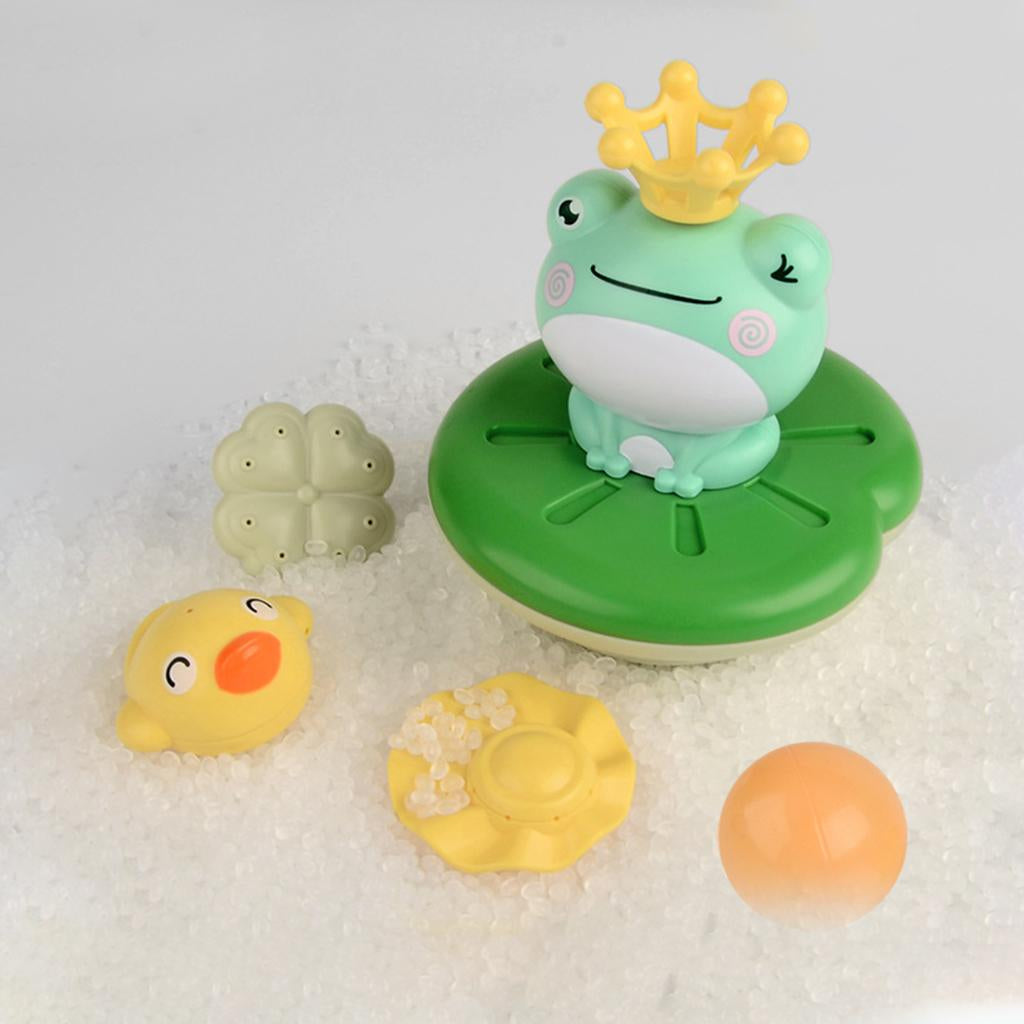 Crowned frog bath fountain surrounded by colorful toppers in a bubbly bath