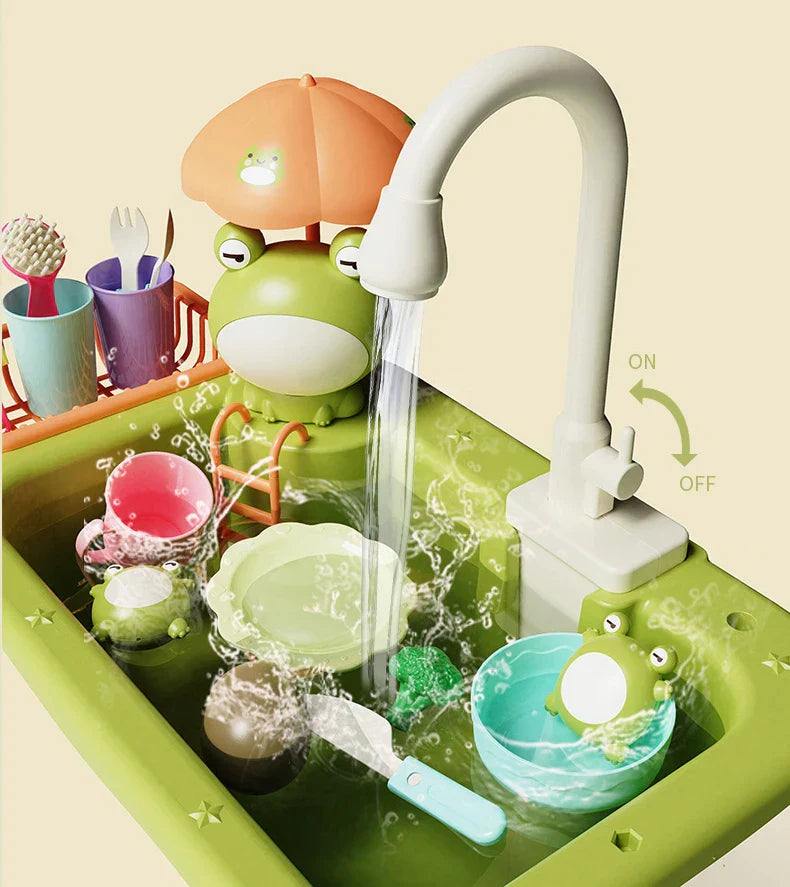 Running water flowing into a green frog play sink filled with toy dishes