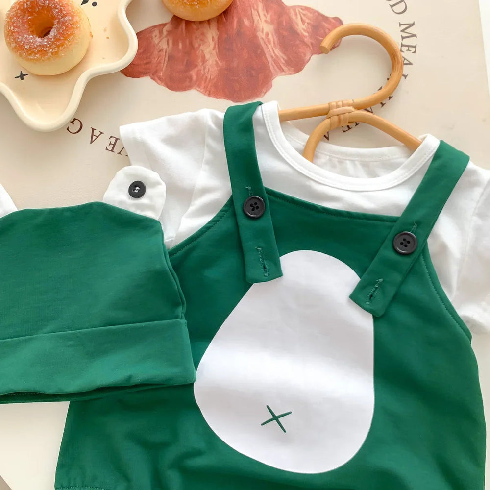 Close-up of the frog romper's buttoned straps, white belly detail and matching cap
