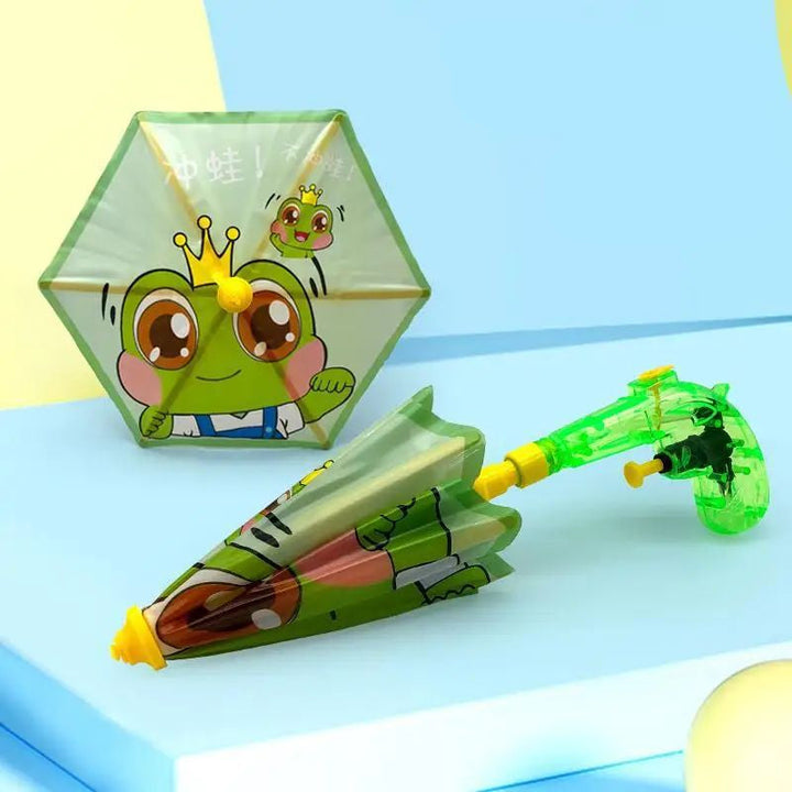 Green frog umbrella water gun shown with its canopy open and folded
