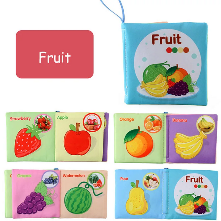 Fruit fabric book with a blue cover and illustrated strawberry, apple, orange, and banana pages.