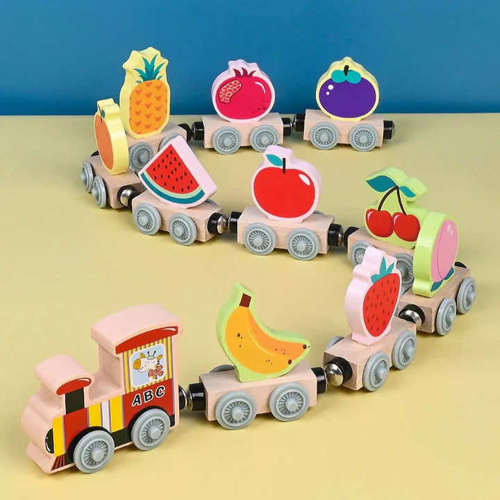 Wooden magnetic fruit train with pineapple, watermelon, banana, and other fruit cars