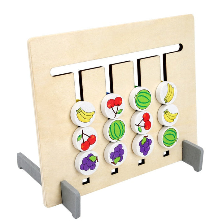 Angled view of the fruit-matching board on its two gray stand supports
