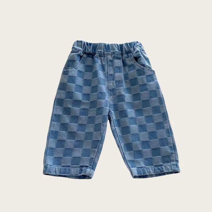 Full-length front view of blue checkerboard pants with an elastic waistband