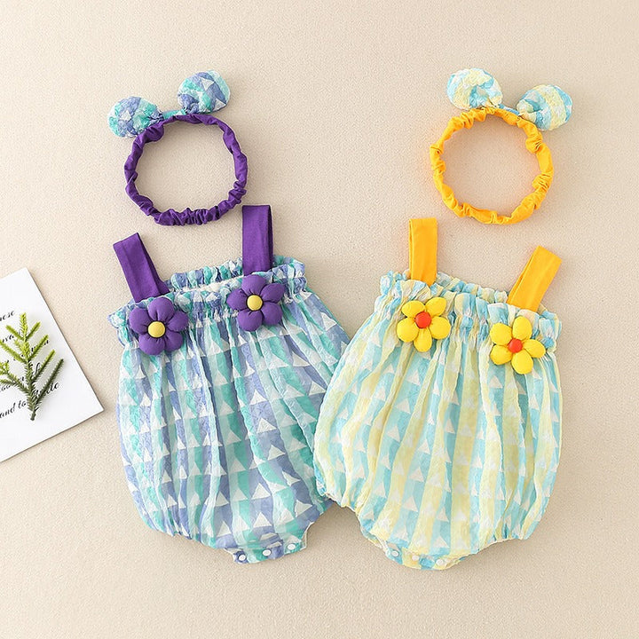 Blue and Green baby rompers with gathered necklines and flower accents, arranged beside matching headbands