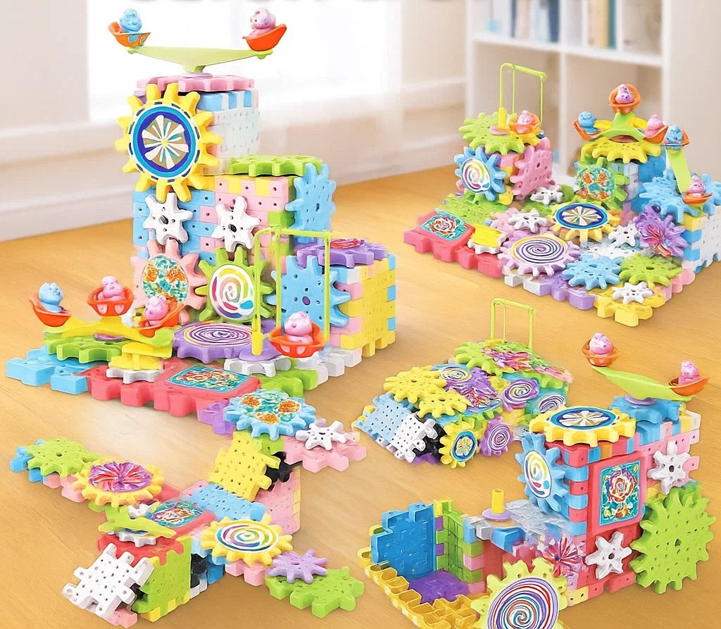 Several gear block creations with connected towers, patterned wheels, and small playground-style rides.
