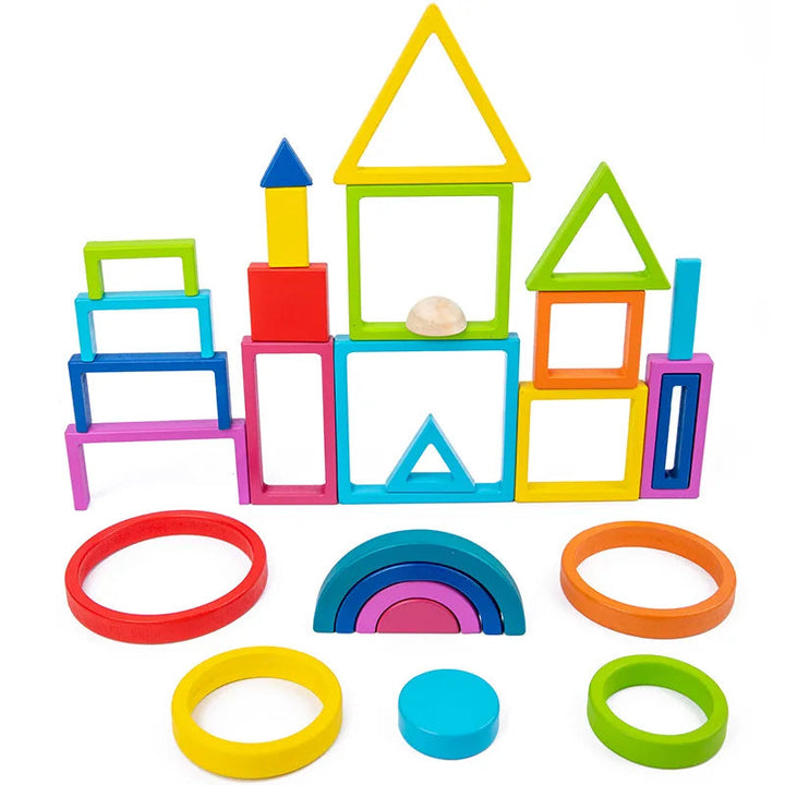 Colorful wooden frames stacked into towers with rings and rainbow arches arranged in front