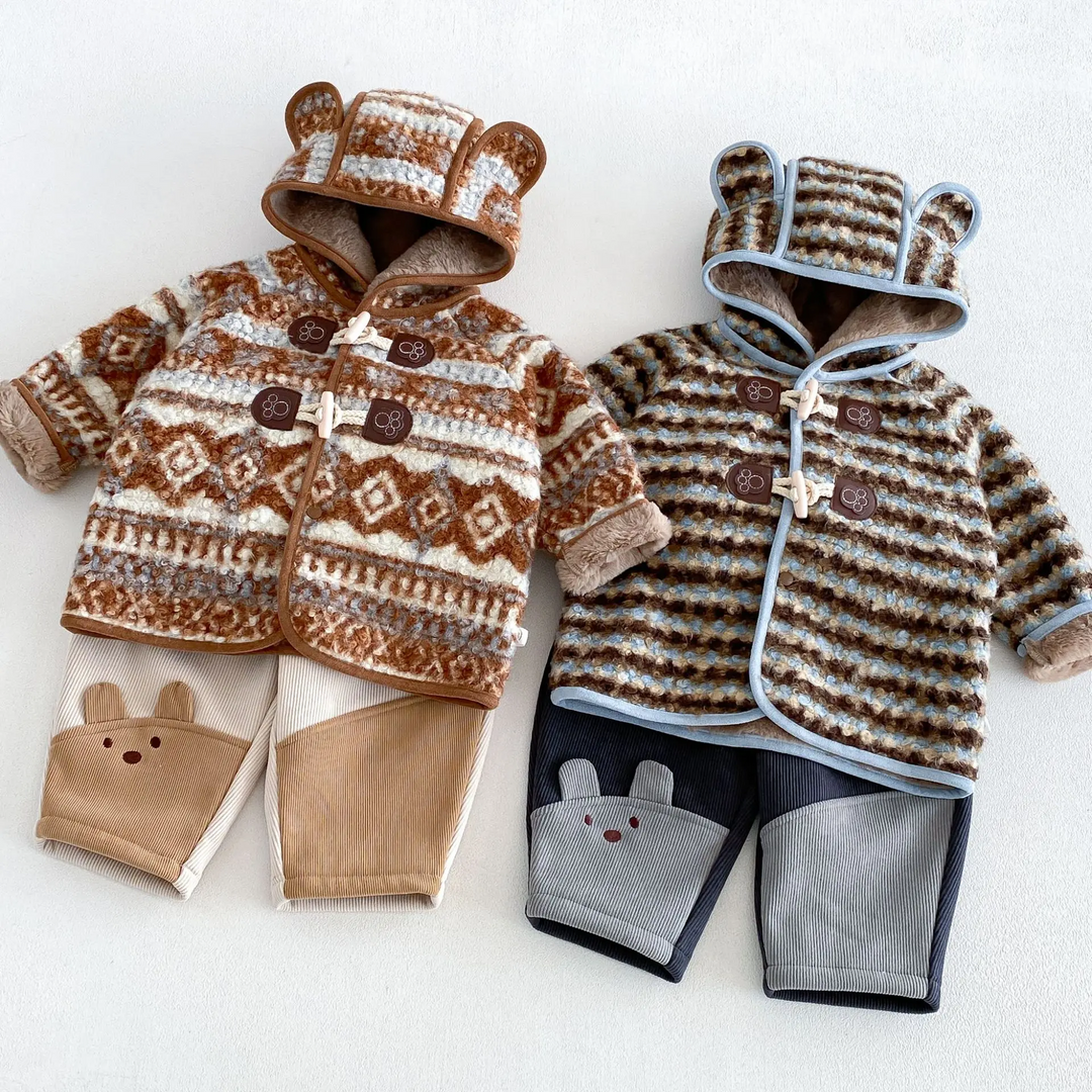 Brown geometric and blue striped winter jackets shown with coordinating color-block pants