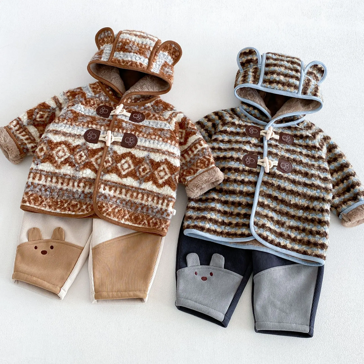 Brown geometric and blue striped winter jackets shown with coordinating color-block pants
