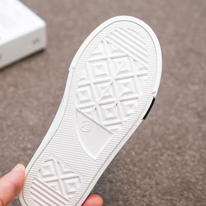 White rubber sneaker outsole with a geometric tread pattern