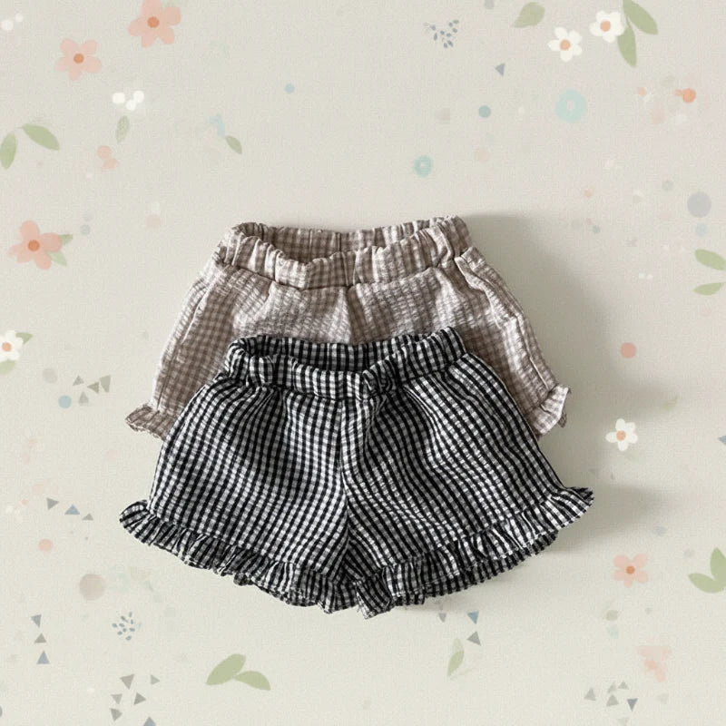Black and Coffee gingham bloomers with gathered waistbands on a floral background