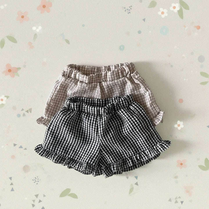 Black and Coffee gingham bloomers with gathered waistbands on a floral background