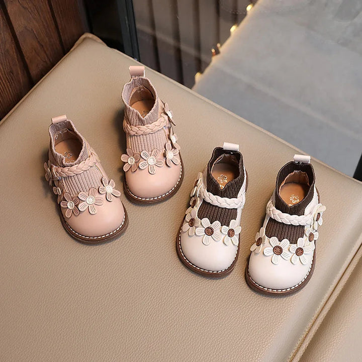 Overhead view of Cream White and Beige floral ankle boots with ribbed cuffs.
