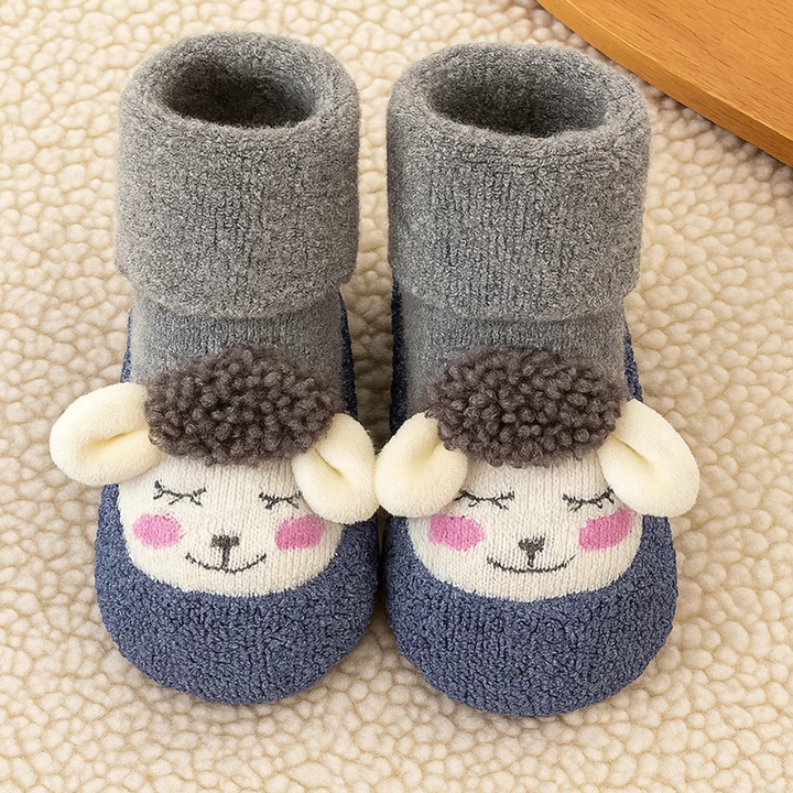 Gray baby socks with blue toes, cream animal faces, pink cheeks, and plush fold-over cuffs